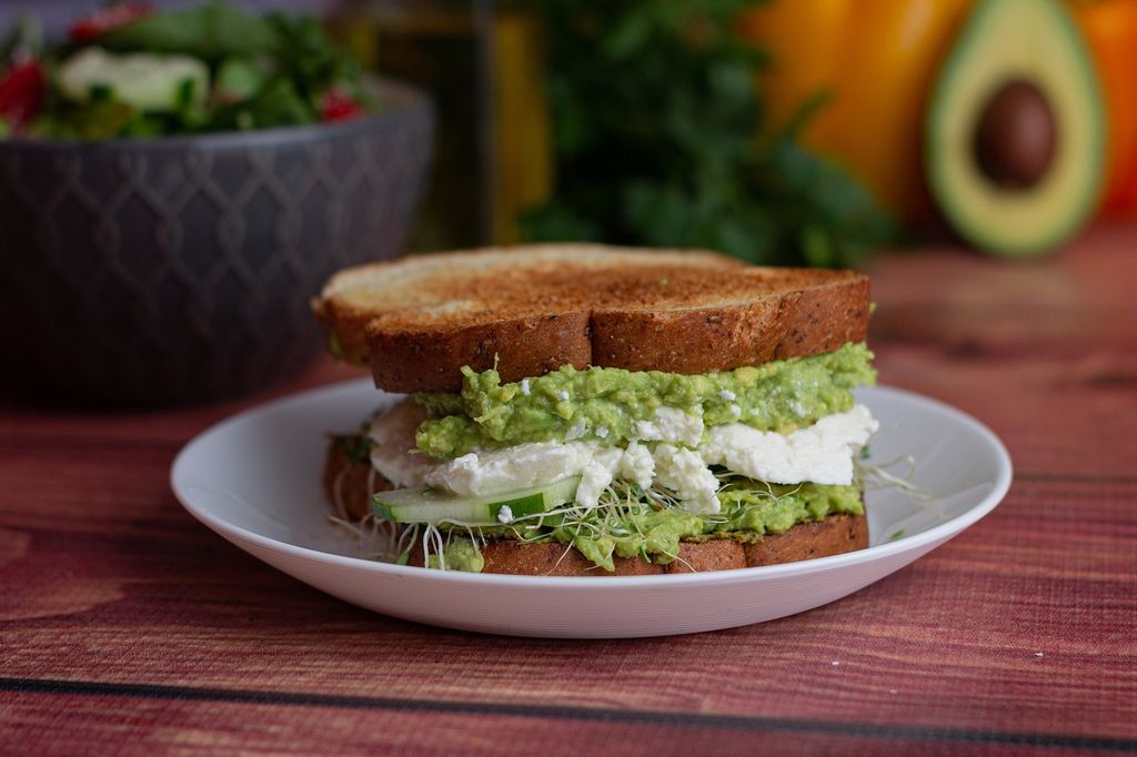 Toasted bread spread with goat cheese and herbs
